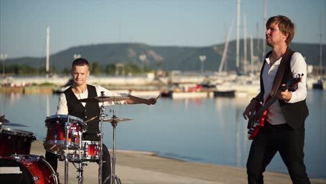 a band performing by the waterfront