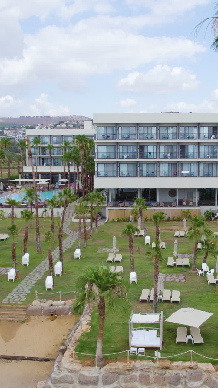 Gomeh Hotel on the shores of the Sea of Galilee - aerial Vertical sliding shot
