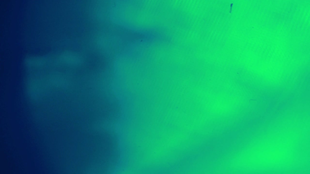 Sfondo dinamico con macchie di luce verdi e blu