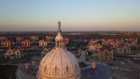 Drone-pilot-stands-on-dome-of-abandoned-building-near-Shanghai,-China