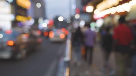 defocused shot of busy street with people and traffic in bangalore india at dusk 1