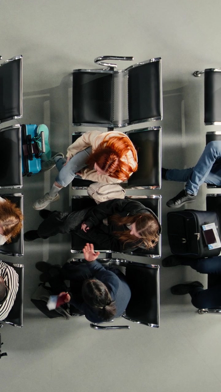 Overhead View of Diverse Passengers Waiting in Airport Lounge