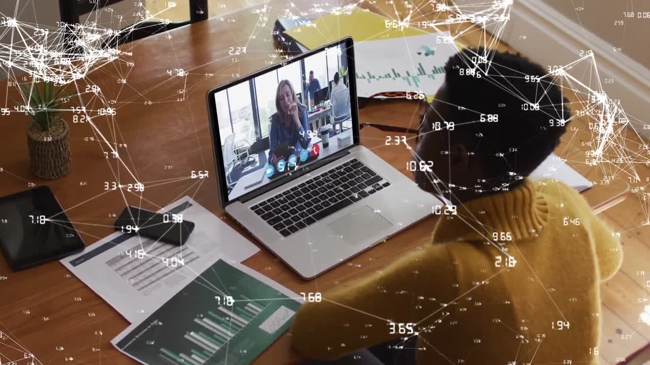 Network of connections against african american woman having a videocall on laptop working from home