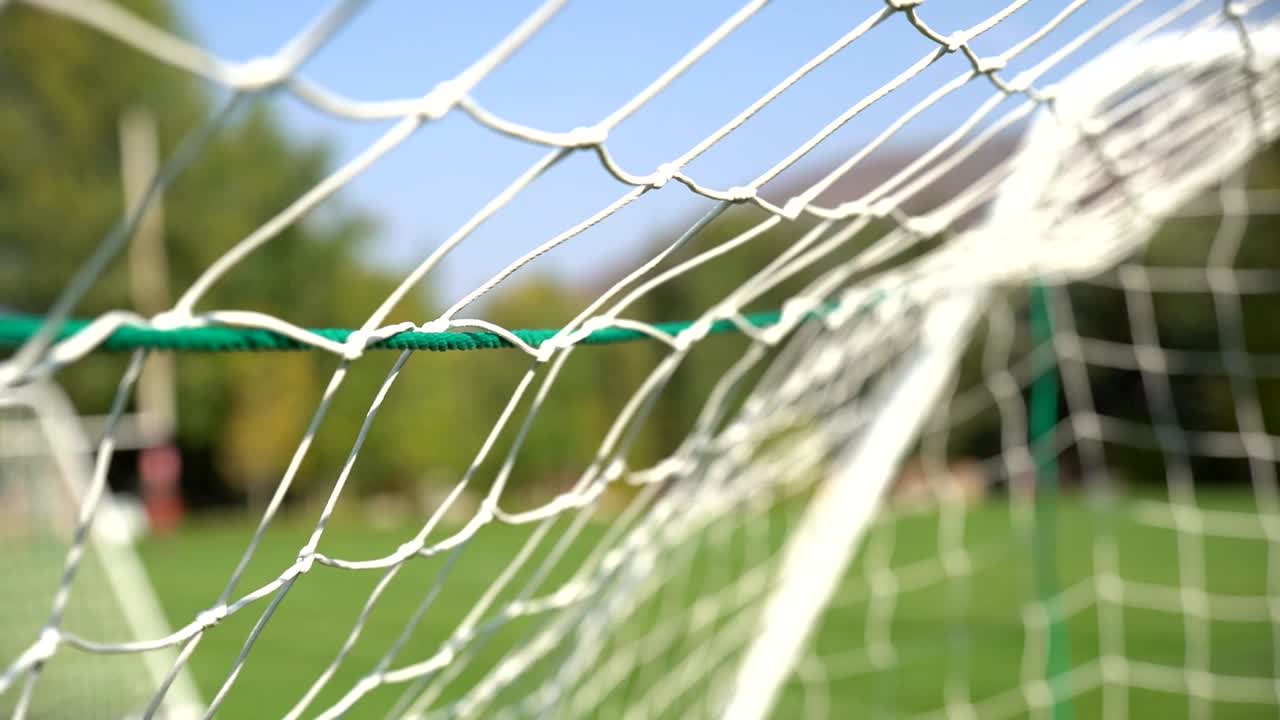 Soccer ball hitting the net in slow motion