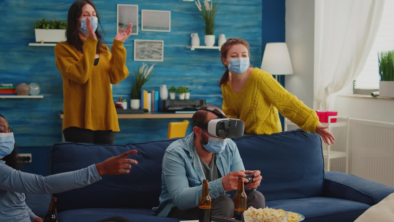 Excited man wearing mask experiencing playing games with vr headset