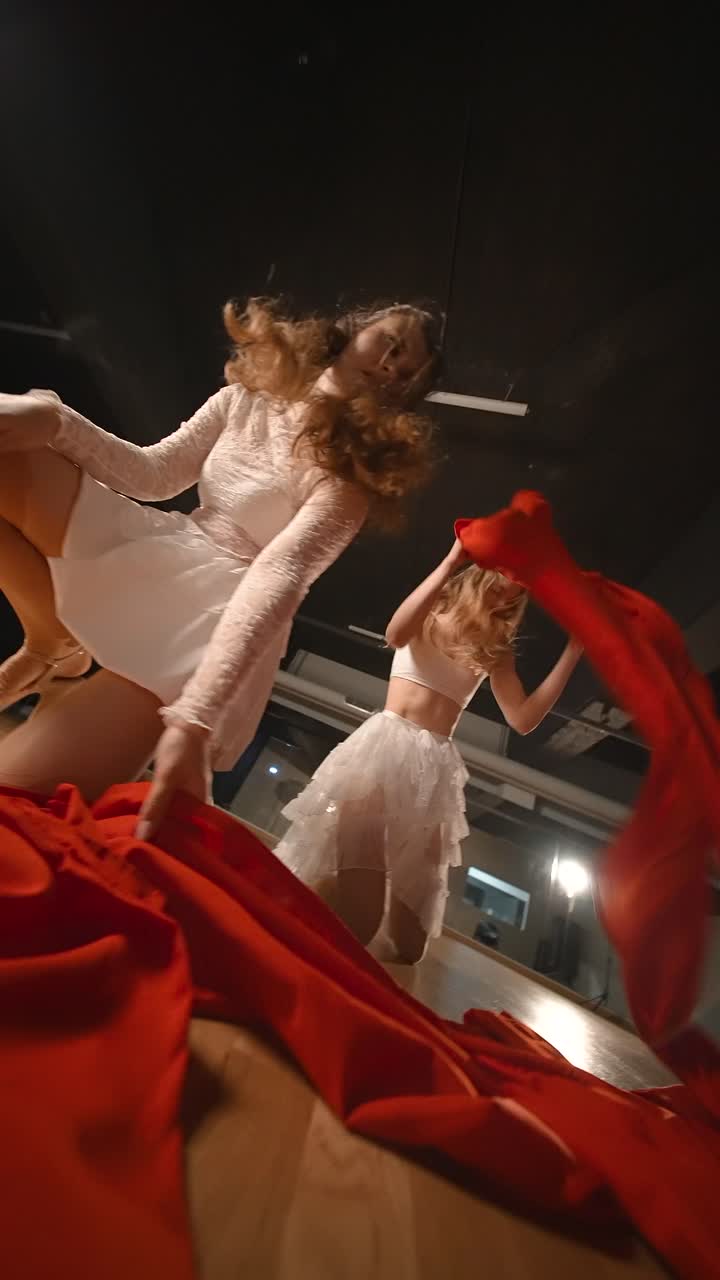 Contemporary Dance Performance with Red Fabric