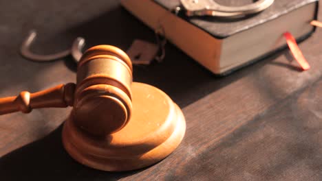 gavel, handcuffs, and law book: symbols of justice and the legal system