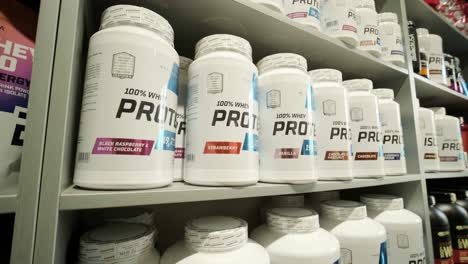 sport nutrition store interior with large choice of nutritional supplements.