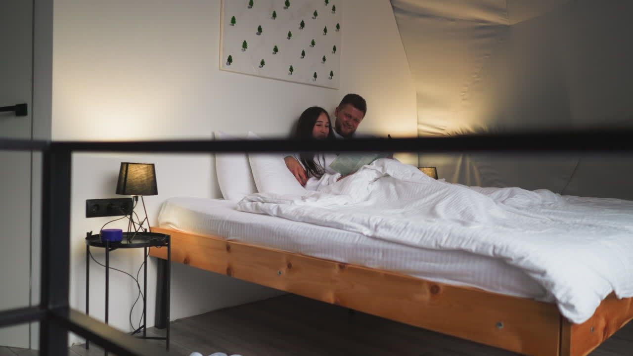 Couple Reading in Bed