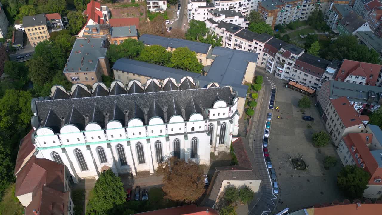 Dome to halle in the city in germany is shining on a sunny summer day. Nice aerial view flight drone shot footage from above