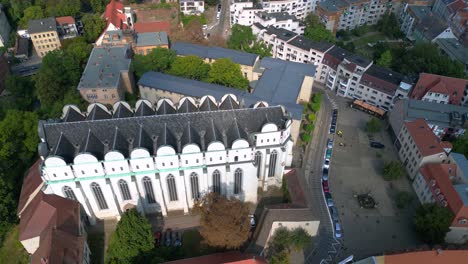 Dome to halle in the city in germany is shining on a sunny summer day. Nice aerial view flight drone shot footage from above