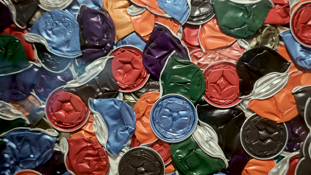 Close up of multiple coffee pods smashed for recycling