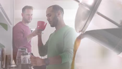 Animation-of-coffee-pot-over-diverse-male-couple-drinking-coffee