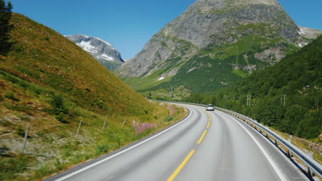 go along the scenic road among the mountains of norway first-person view