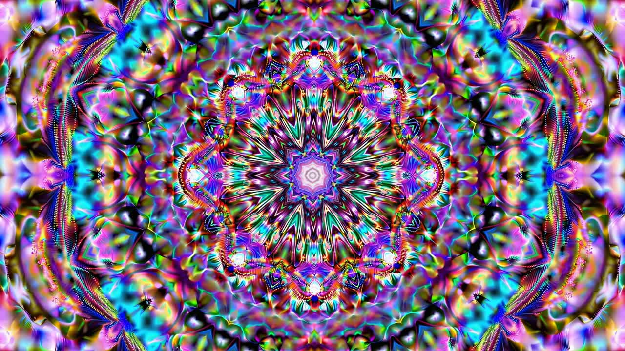 A kaleidoscopic video image with vibrant, symmetrical patterns