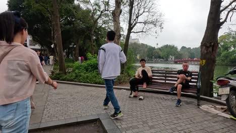 people walking, sitting, and enjoying the park