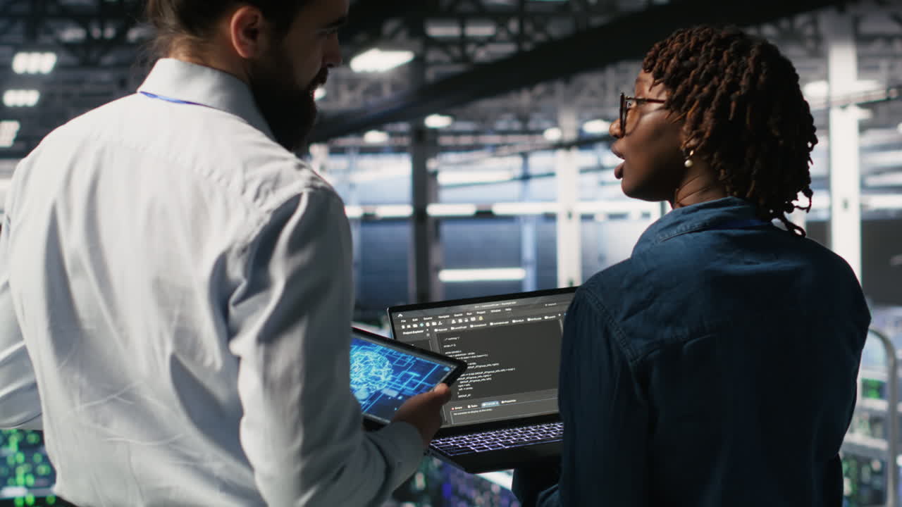 Server farm manager overseeing workers doing AI automatization
