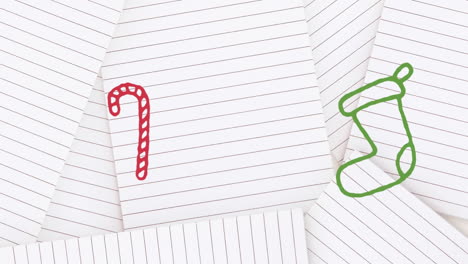 animation of hand drawing christmas decorations on white paper background