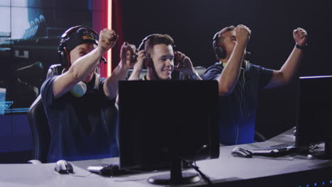 gaming team winning a match medium closeup of a gaming team winning a match at a tournament