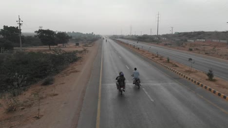 Aerial-Following-Motorbike-On-M9-Motorway-In-Pakistan