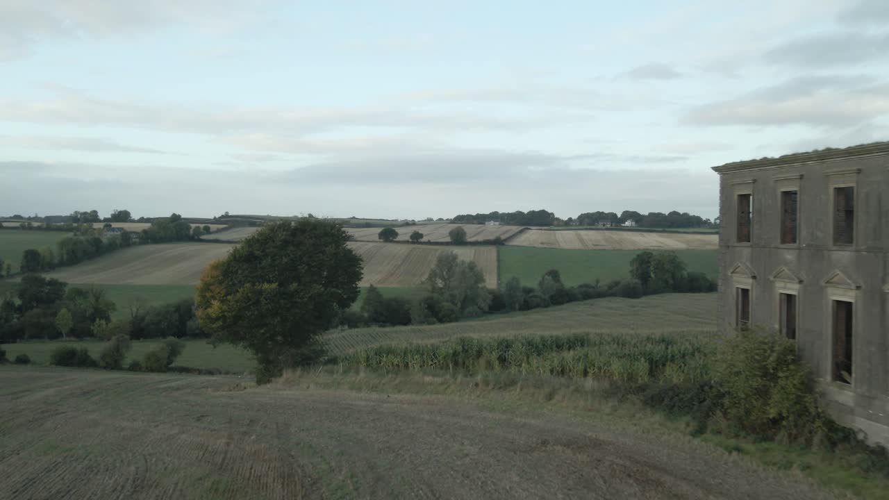 Old Stephenstown House surrounded by rural fields and trees in County Louth, Ireland at dusk