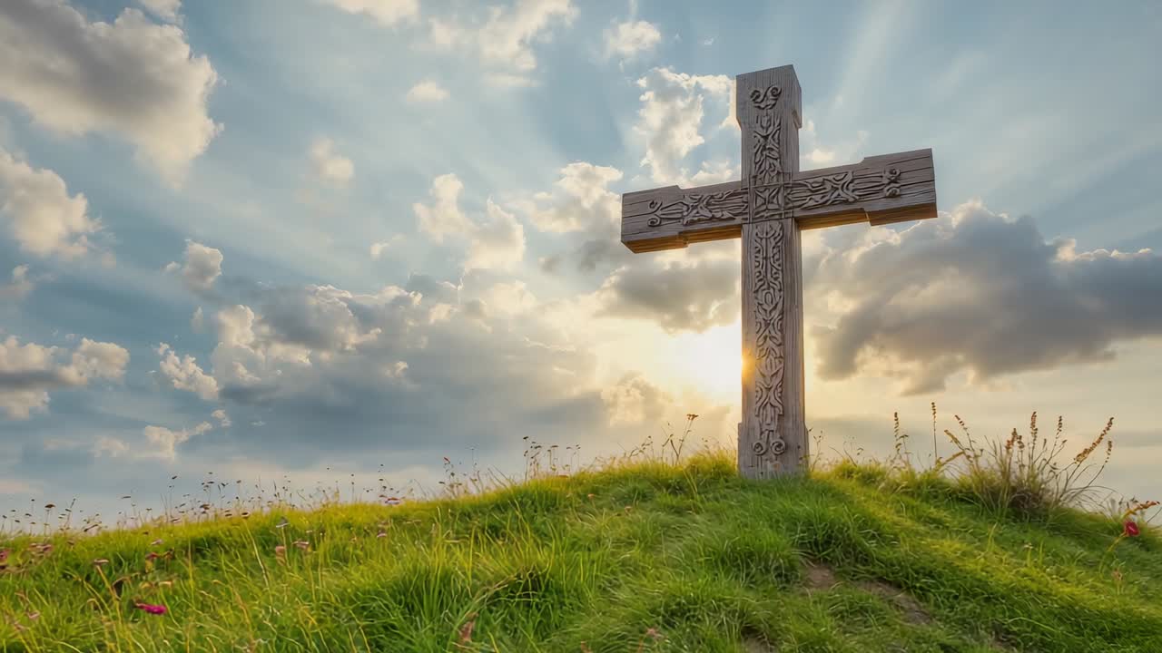 Light breeze causing clouds drifting and wildflowers swaying around carved wooden cross on hilltop