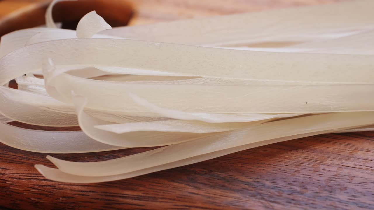 Raw Glass Noodles on Wooden Cutting Board