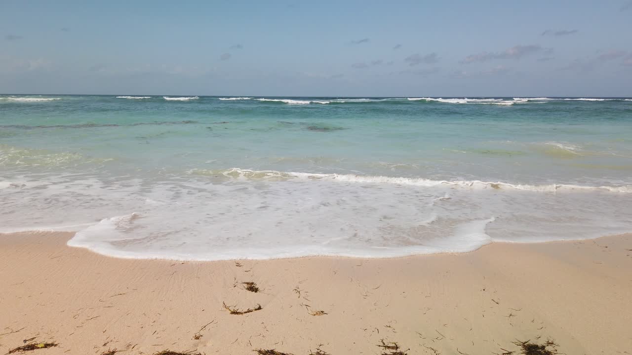 Walking on tropical beach in Bali Indonesia. Waves and ocean with some cloud in distance. Pandawa beach adventure destination for surfing. Dream trip with stunning nature.