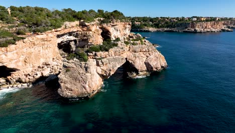 Bird-flying-next-to-Es-Pontas-in-Slowmotion-on-Mallorca,-Spain