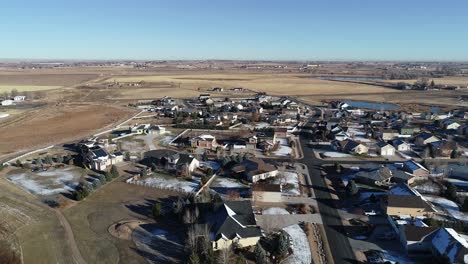 a drone shot above an upper middle class neighborhood early morning in northern colorado