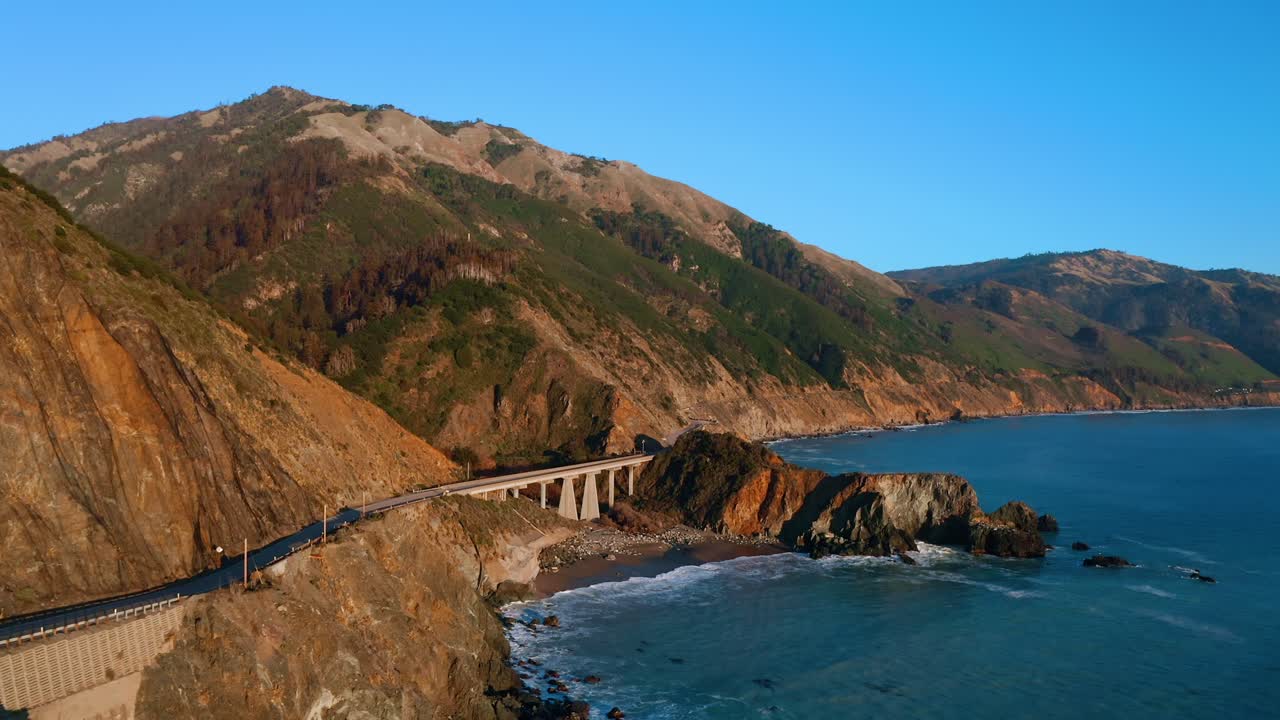 A Beautiful aerial shot of highway 1 running alongside the California coast