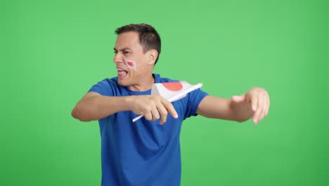 man cheering for japan, angry with the decision of referee