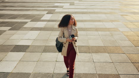 business, woman and walking on sidewalk in city