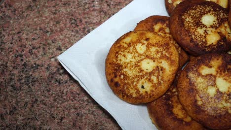 sweet cheese pancakes on a plate on a white background