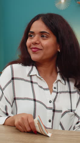 indian woman counts euro money cash satisfied with salary bonus feeling proud profitable success