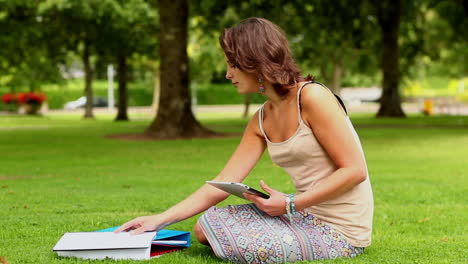 Pretty-student-using-tablet-pc-outside