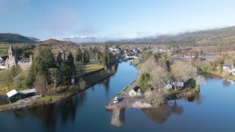 aerial boom shot reveals fort augustus on loch ness in scotland