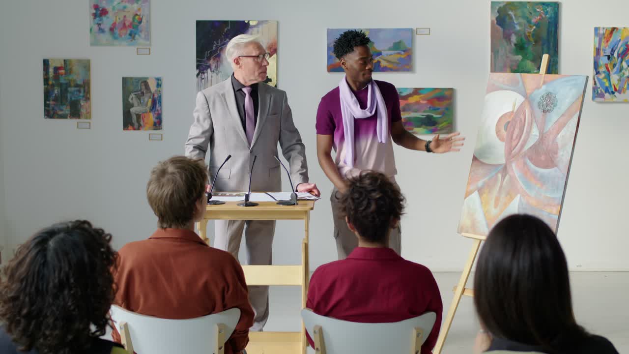 Artist Presenting Painting in Auction House