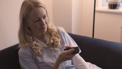 a woman watching tv