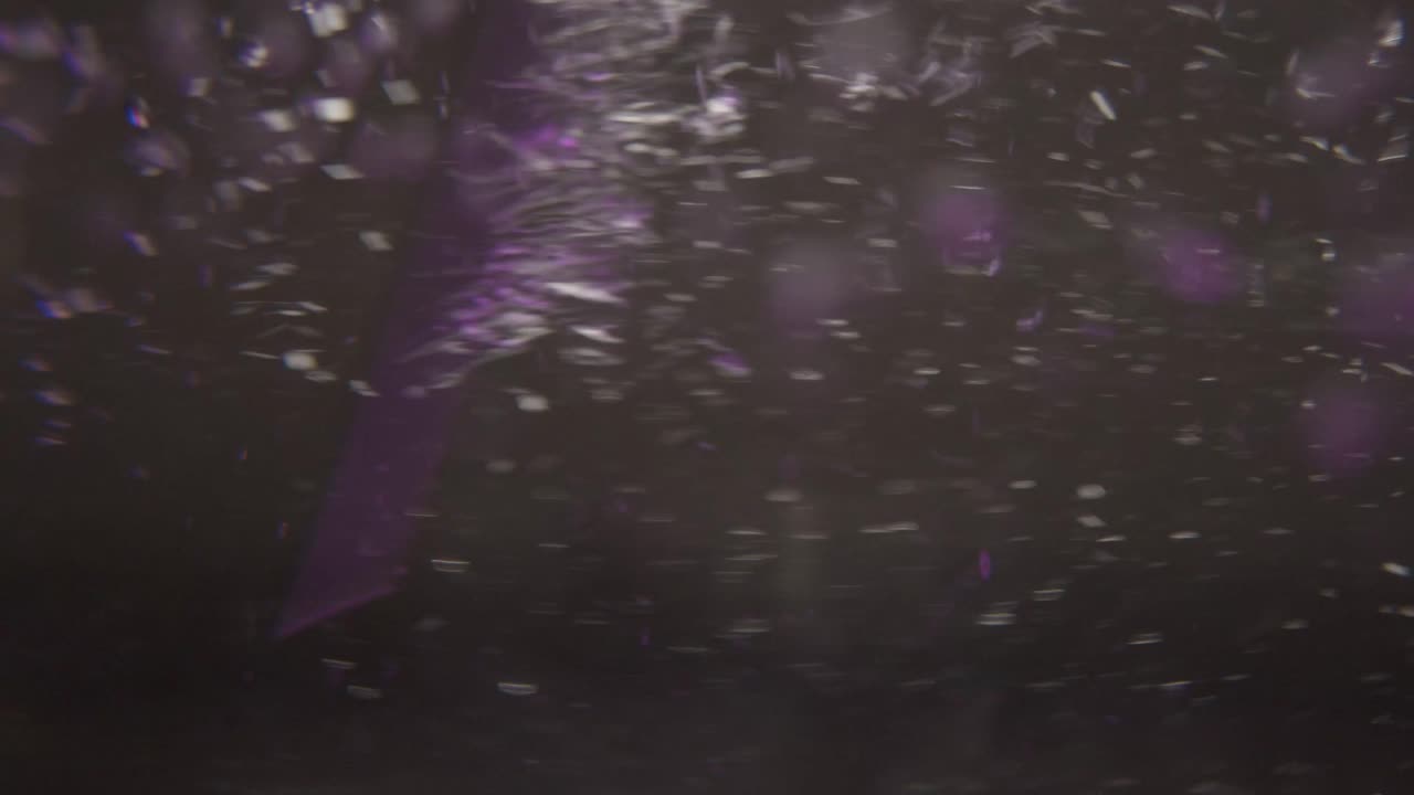 Stirring Purple Lighted Water