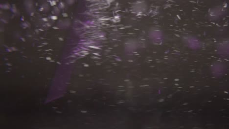 stirring purple lighted water