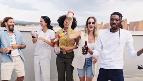 Group of people celebrating a party on the rooftop