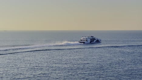 speed vessel cruising in the morning in greece