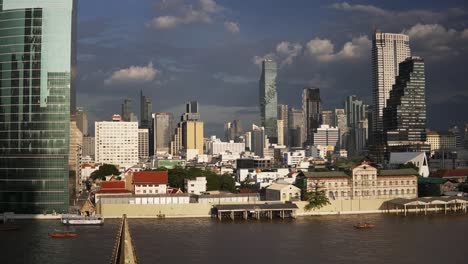 a scenic panorama view of bangkok city skyline in sunny weather with fluffy clouds in the sky
