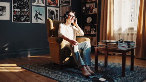 woman listening to music in a cozy home