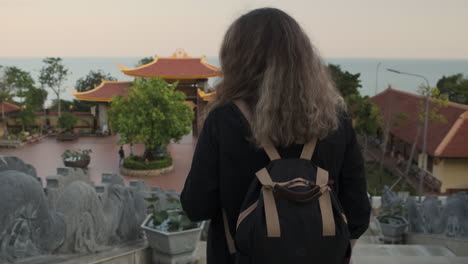 woman exploring a temple complex