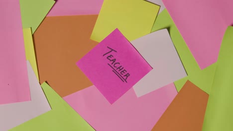 education concept of revolving sticky notes with teacher written on top note