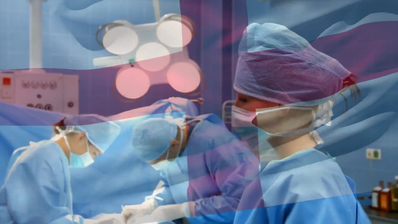 수술실에서 외과 의사 들 위 에 흔들리는 영국 국기 의 애니메이션