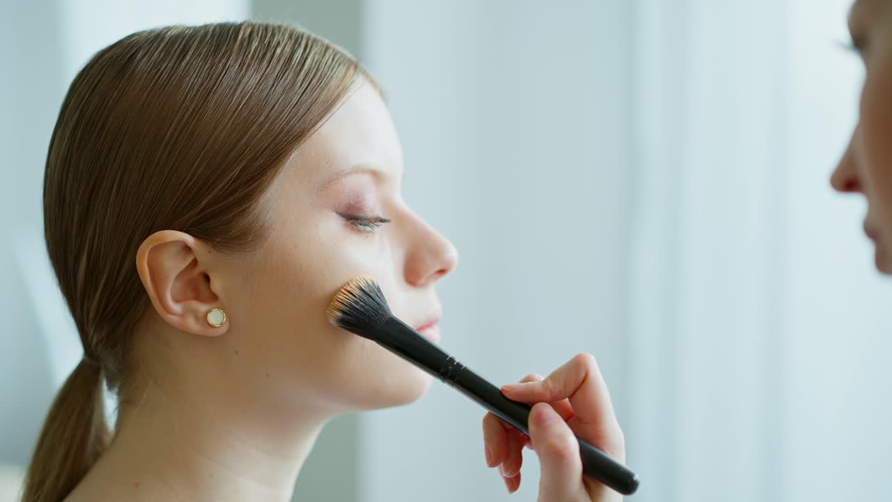 Makeup Artist Applying Foundation