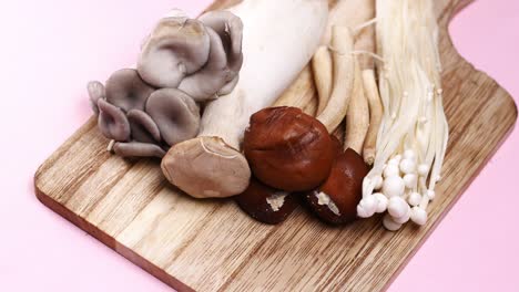 Mixed-mushroom-on-chopping-board-,